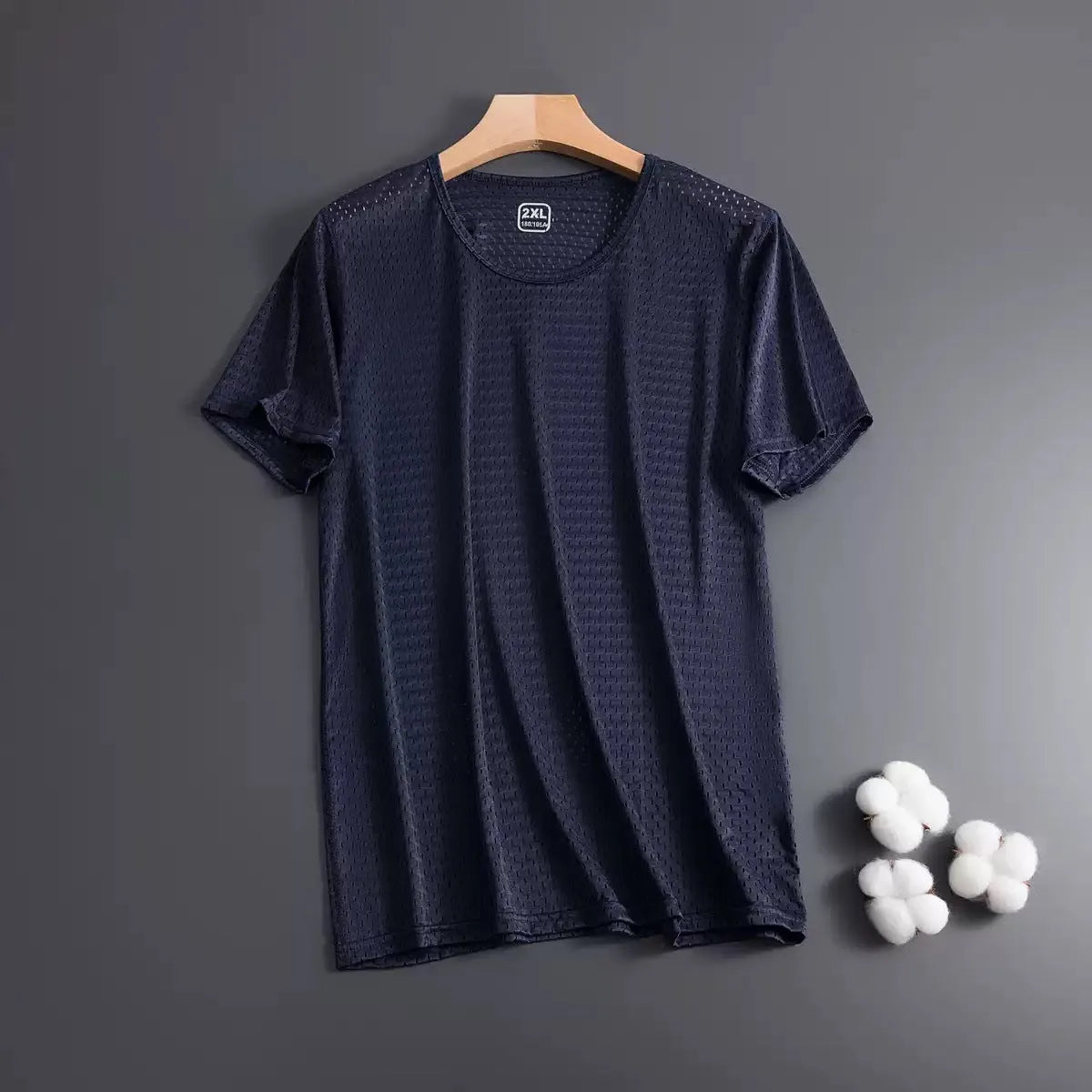 Man wearing a loose-fit grey Ice Silk short sleeve crew neck T-shirt.