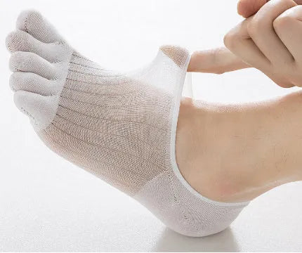 Modal five-finger boat socks in black, shown on a foot with invisible no-show style.