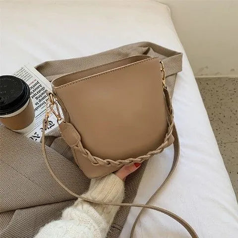 Retro khaki woven PU leather one-shoulder crossbody underarm bucket bag.