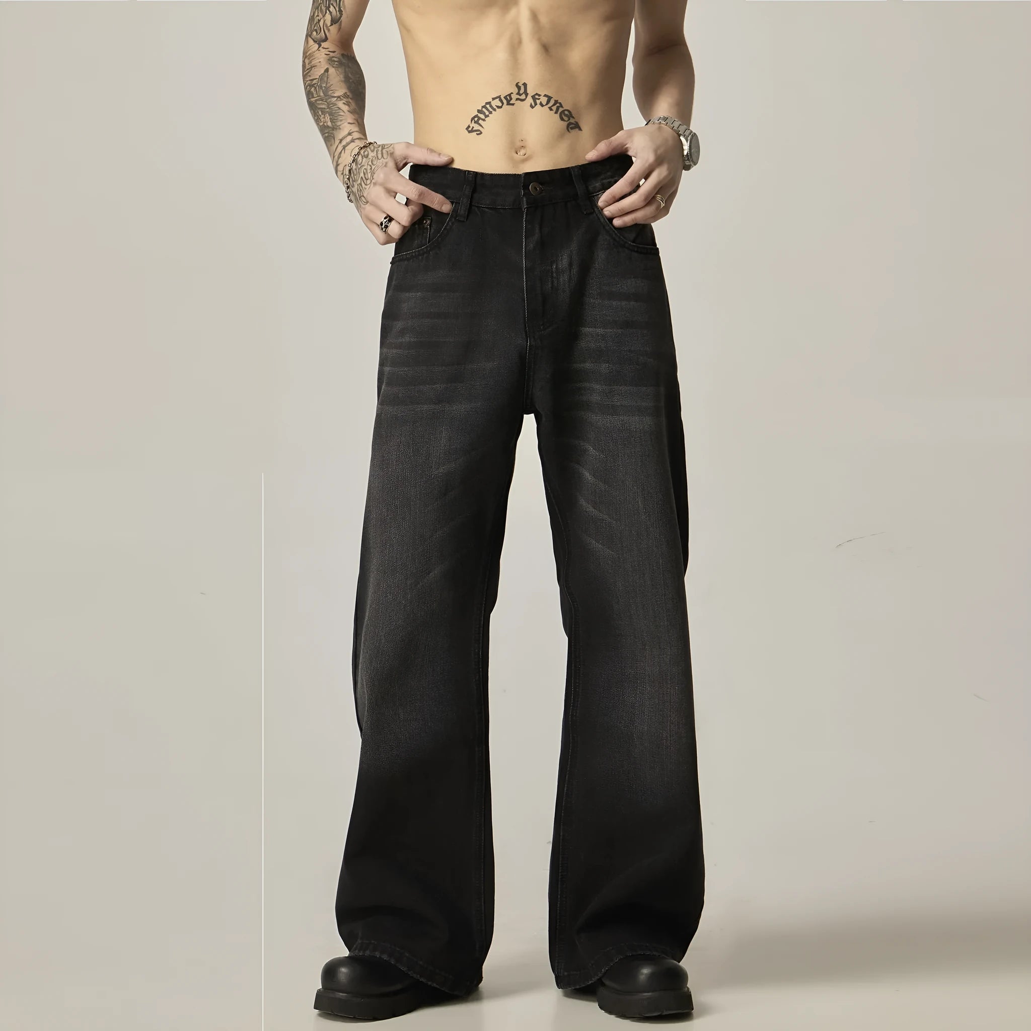 Black straight leg jeans with loose retro styling and basic zip fly design