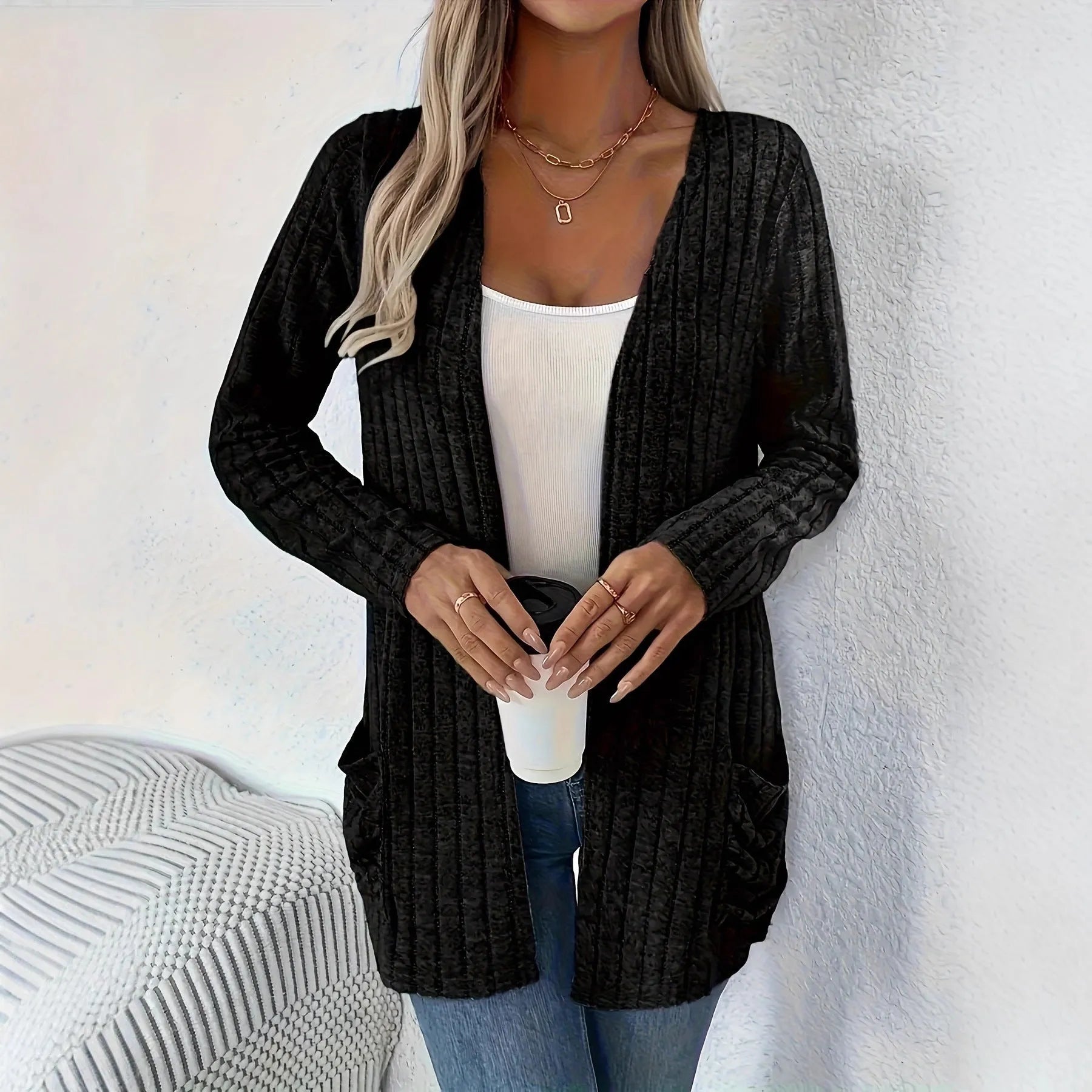 Solid colour loose fit long sleeve cardigan with front pocket in grey or black.