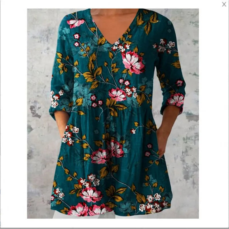 Women's long loose dress with a blue and white wave print pattern, featuring three-quarter sleeves and a wide waist.