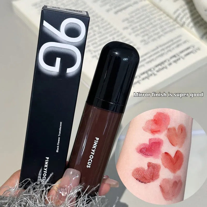 Mirror Lip Paint lacquer tube in six dark berry and tomato red shades for glossy, durable wear.