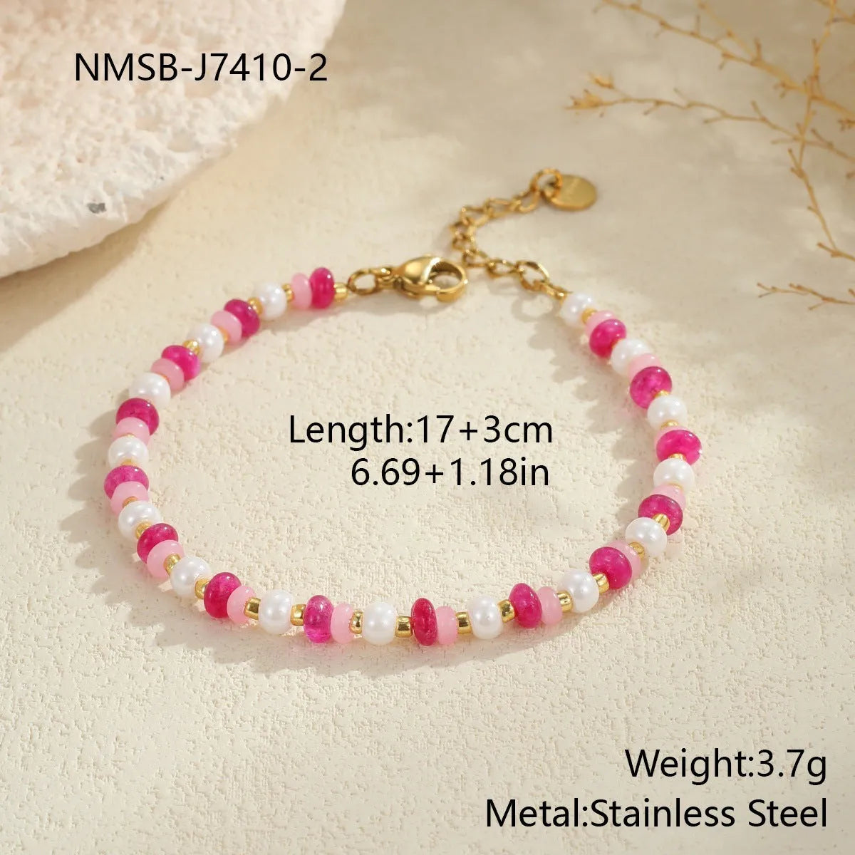 18K gold plated stainless steel chain necklace with pink electroplated resin bead pendant on white background