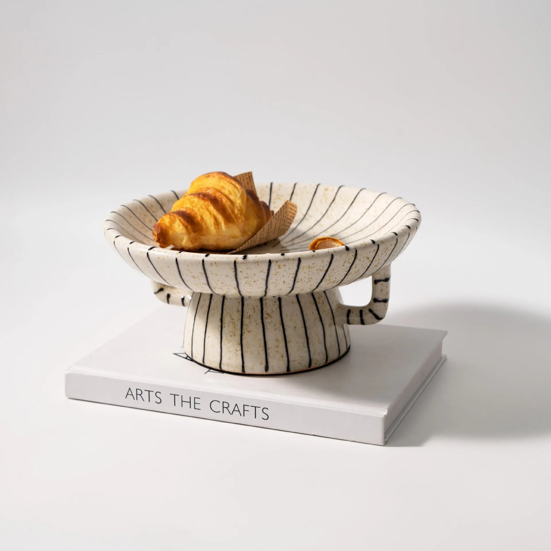 Black and white striped synthetic resin fruit plate for dessert serving