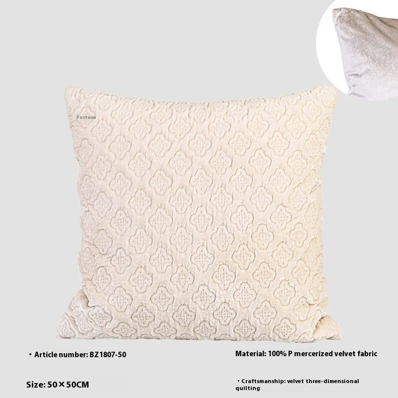 Brown gold antique style three-dimensional quilted cushion pillow on a sofa.