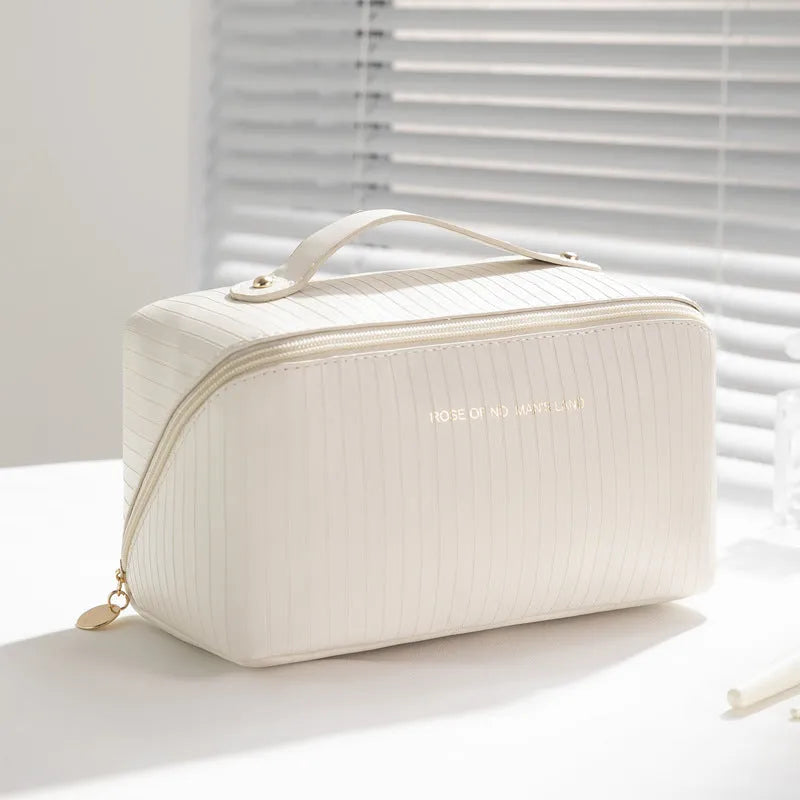 Vertical pattern pillow makeup bag in cubic design measuring 22.5cm height with travel storage capacity