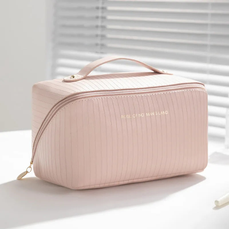 Vertical pattern pillow makeup bag in cubic design measuring 22.5cm height with travel storage capacity