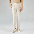 Men's straight-leg corduroy trousers in loose fit, shown in beige colour