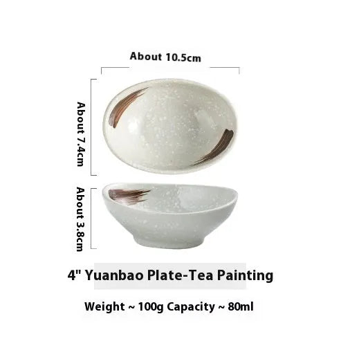 Oval Japanese ceramic sauce dipping bowl with underglaze finish on a table.