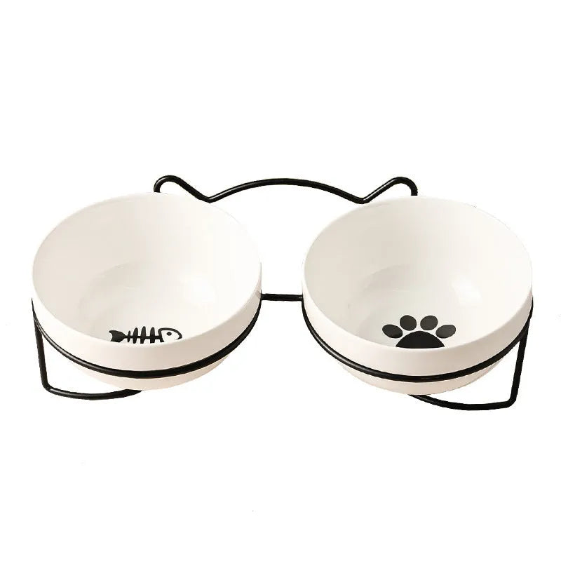 White ceramic cat bowl with decorative patterns on iron frame with cat ear details
