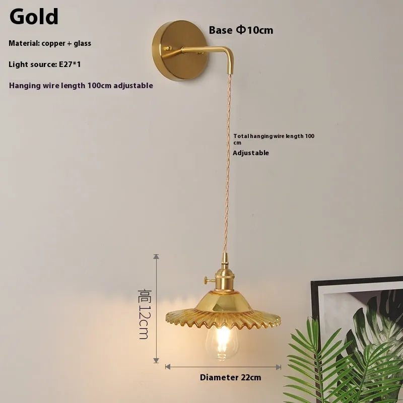 Retro brass lotus wall lamp with a glass shade in a choice of six colours.