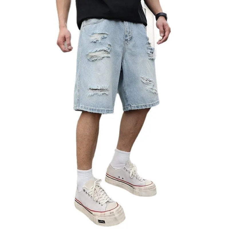 Light blue ripped denim shorts with distressing and straight-leg cut for casual hip hop style