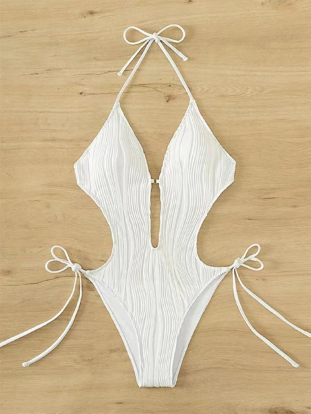 Women's black lace-up triangle bikini swimsuit on a mannequin
