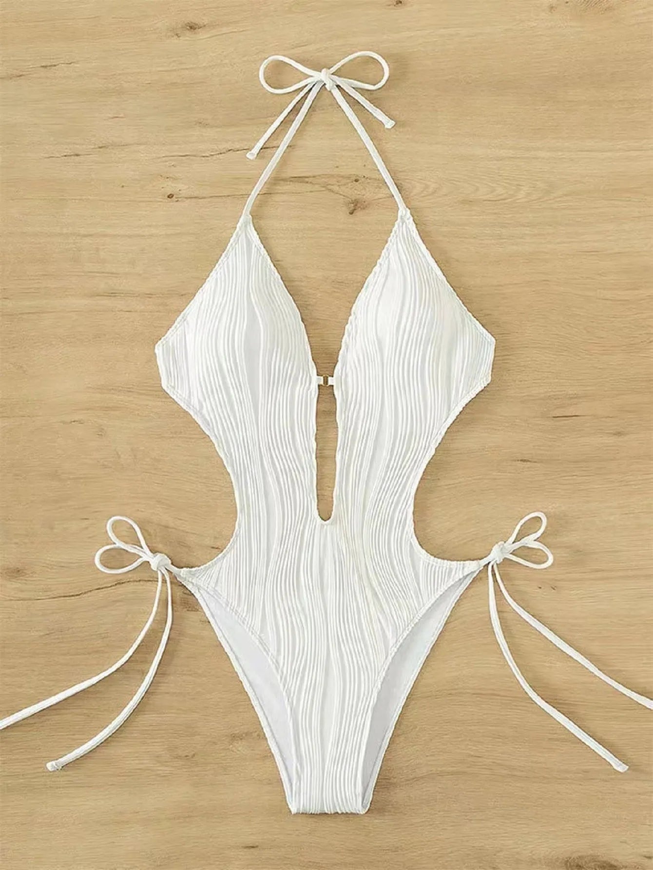 Women's black lace-up triangle bikini swimsuit on a mannequin