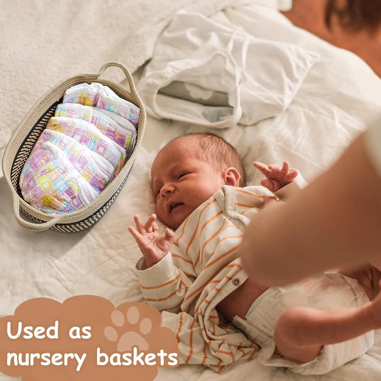 Light beige handmade woven cotton rope storage basket with wooden base and handle on a table.
