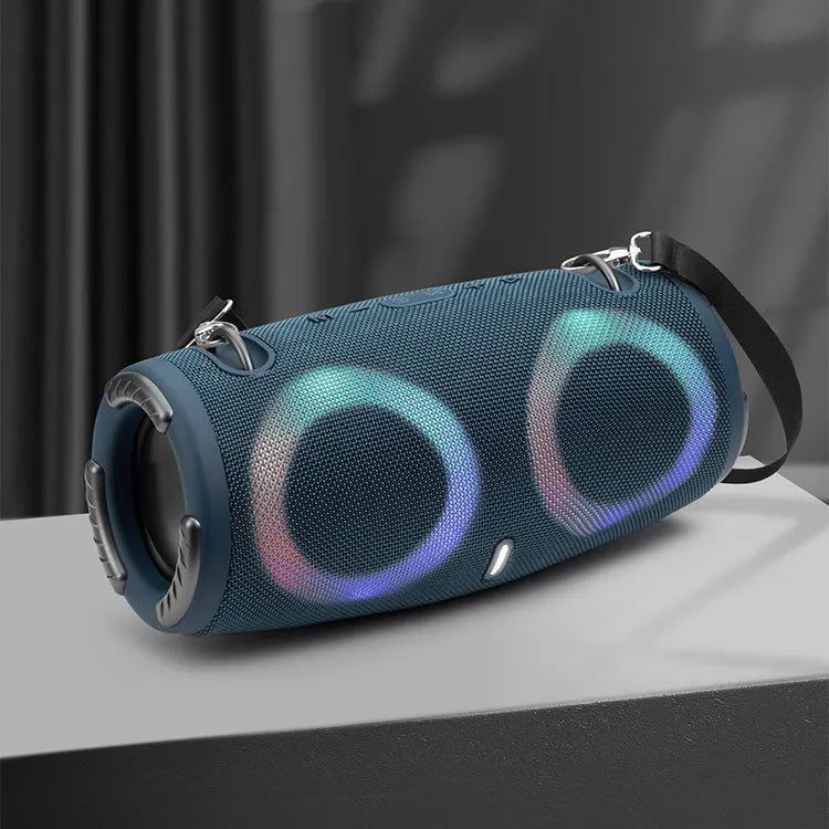 War Drum portable Bluetooth speaker with RGB coloured lights in outdoor setting