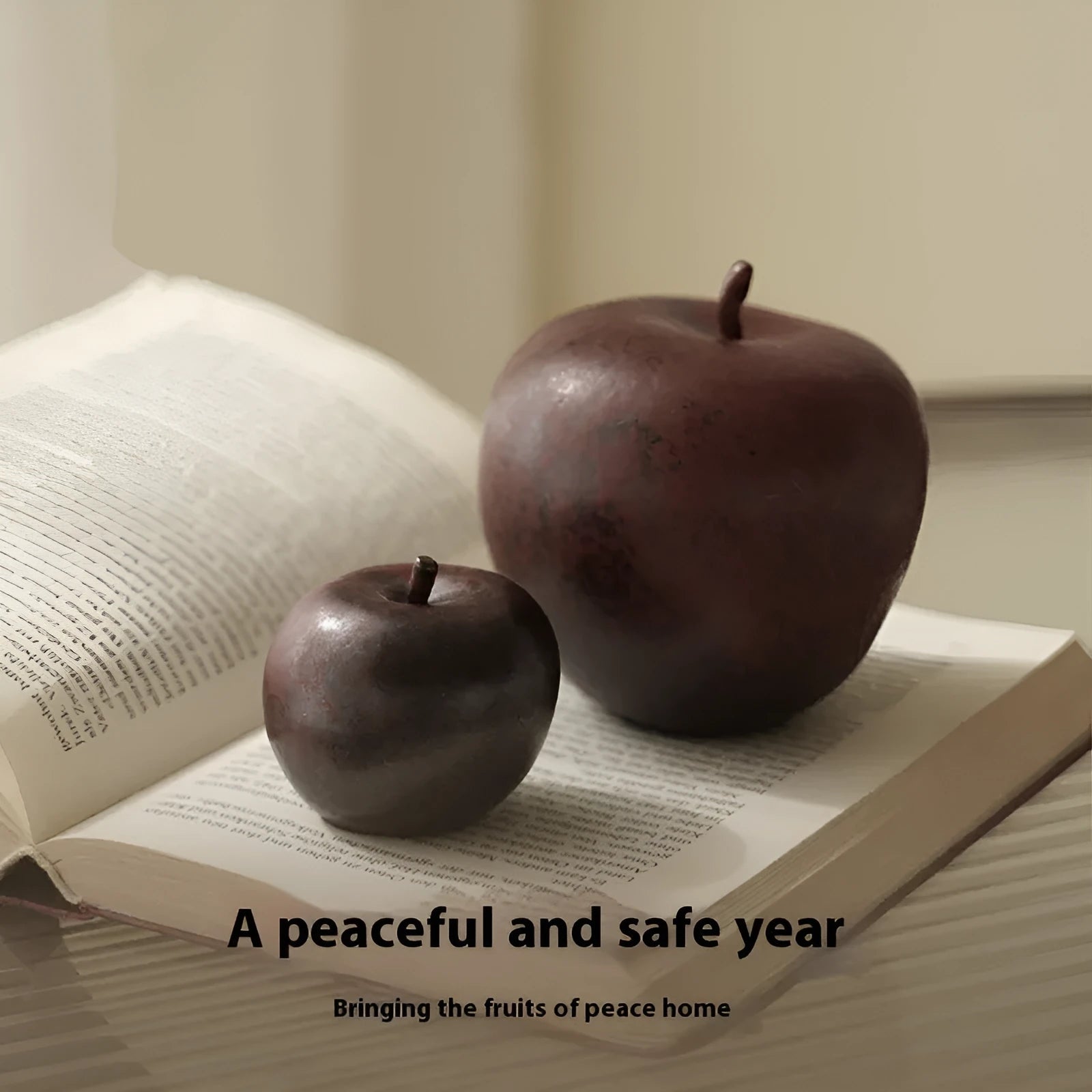 Ceramic apple decoration ornament on a desk, shown in large and small size options.