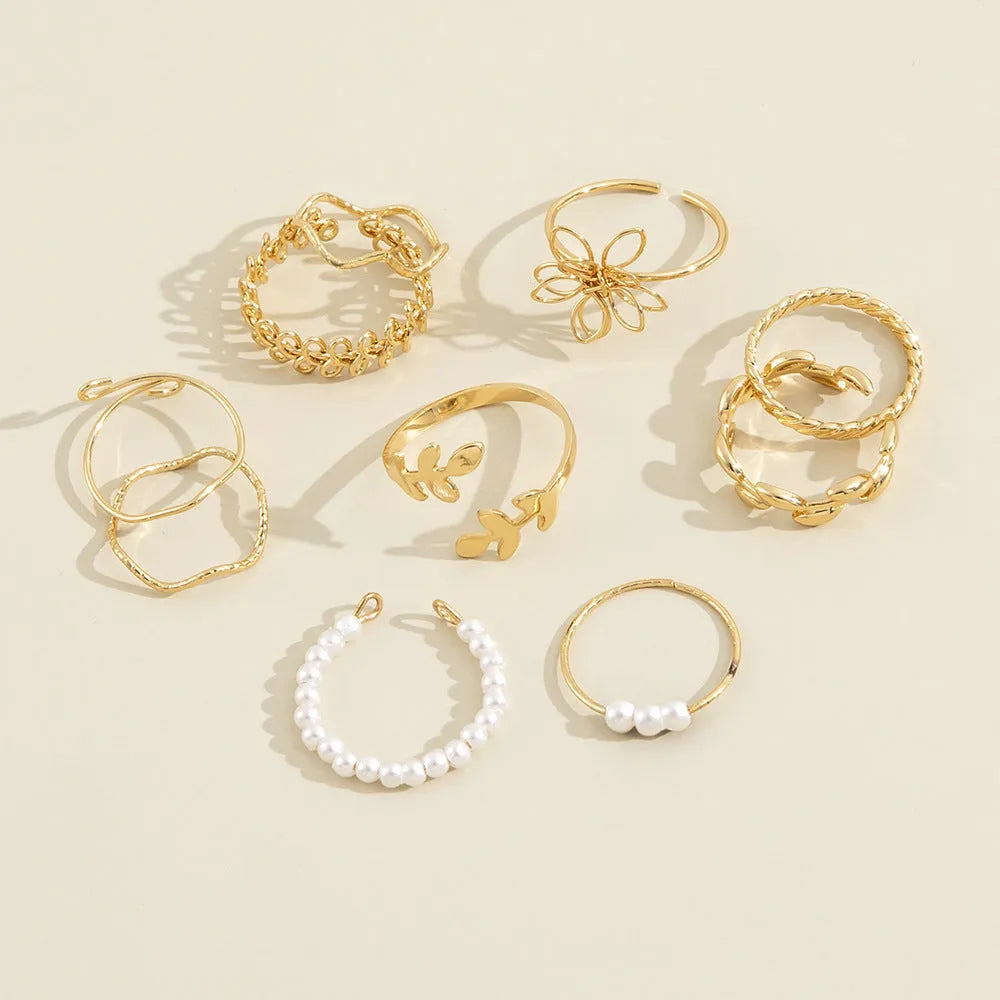 Gold tone openwork flower ring with electroplated glossy finish and women's jewellery design