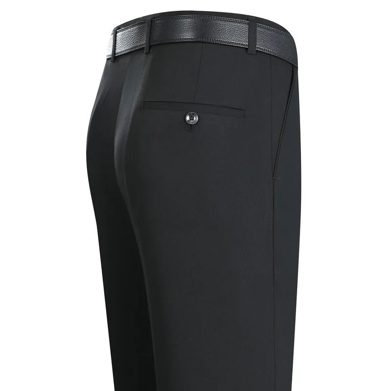 Man wearing dark blue straight-leg suit pants with a high waist, made from a non-ironing mulberry silk blend fabric.