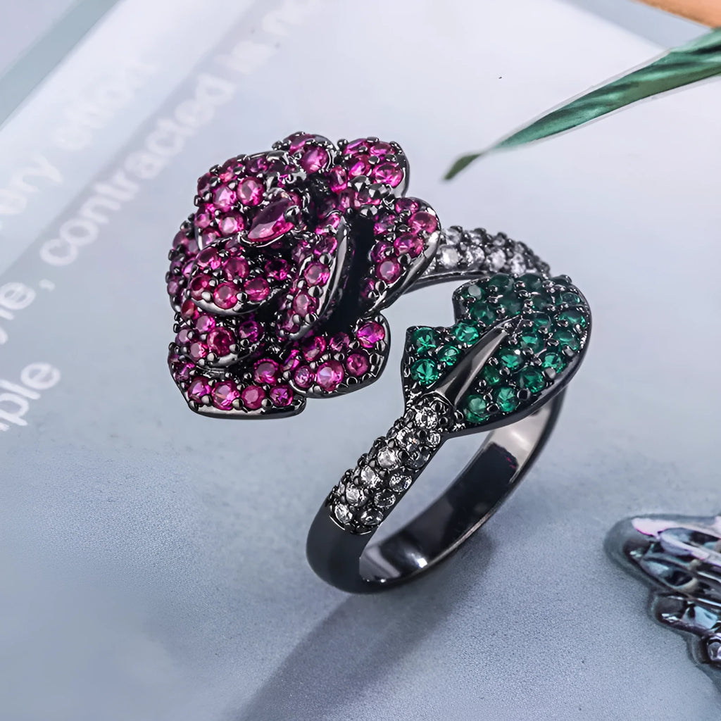 Gold-plated geometric flower ring with red simulated corundum stone on black gold band