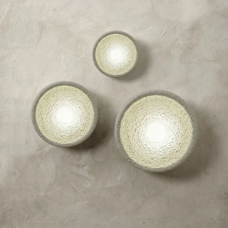 Japanese-style simple modern wall lamp with round resin shade in warm light
