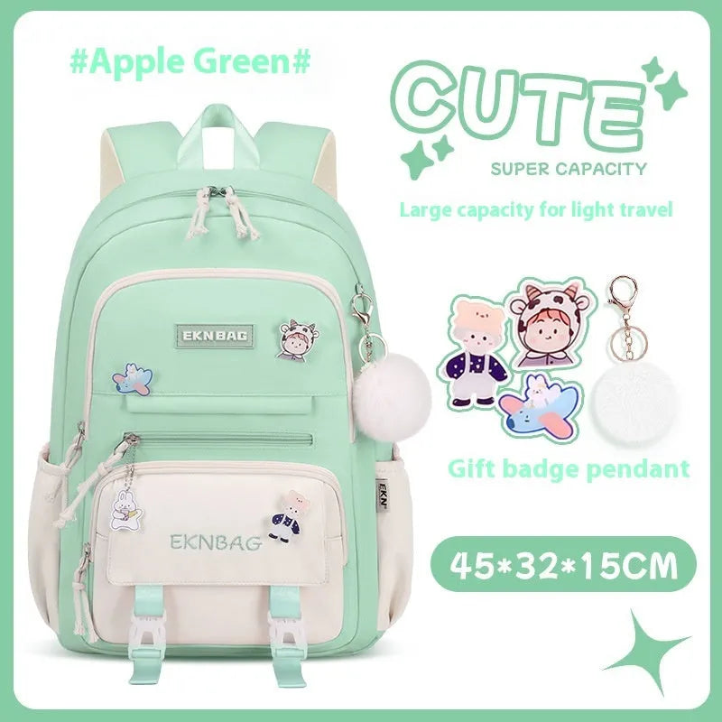 Pink waterproof Oxford cloth school backpack for girls with curved shoulder straps on a white background.