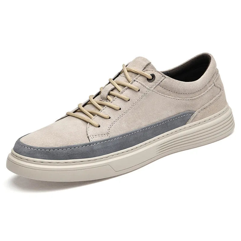 Men's grey casual skate shoes with pigskin upper and rubber sole showing lace-up front design