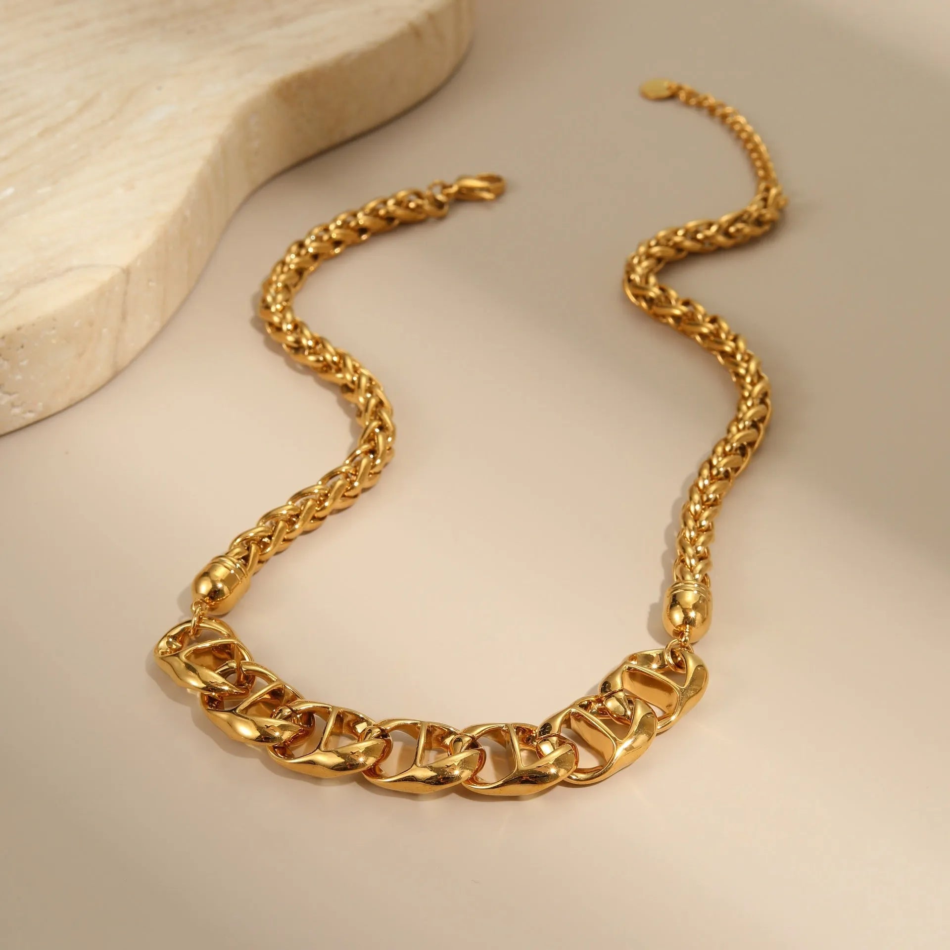 Stainless steel geometric pendant necklace with gold electroplating and chain design details