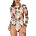 Backless one-piece swimsuit with green leaf floral print on black background