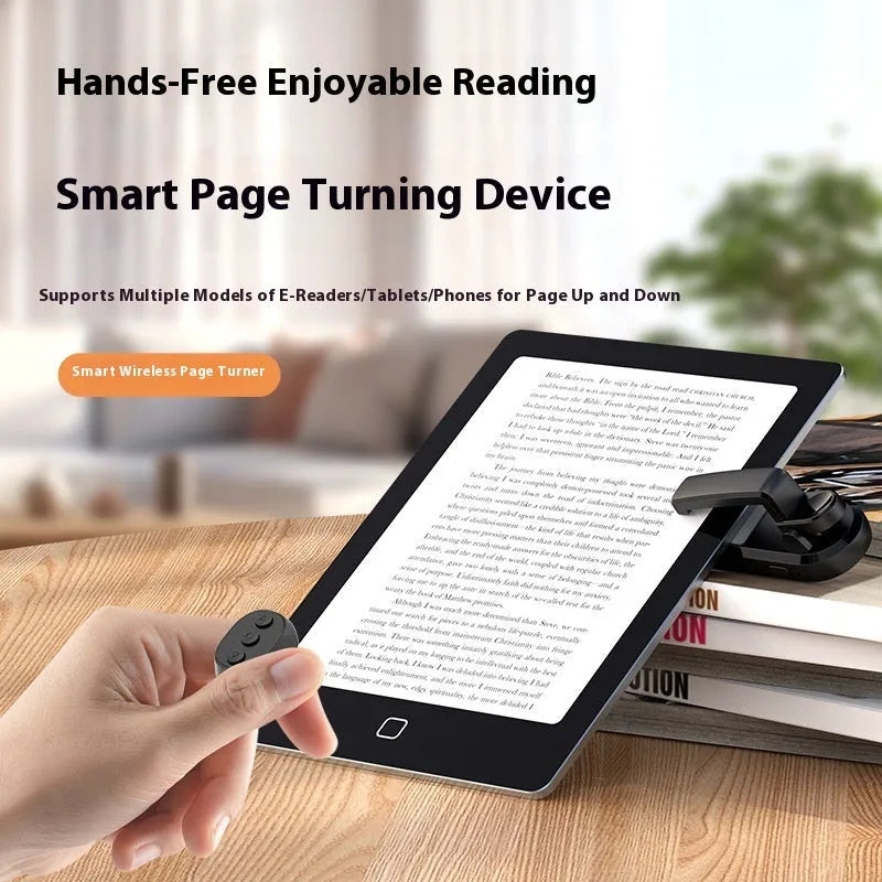 A black wireless page turner remote control and a separate clicker unit on a wooden desk.