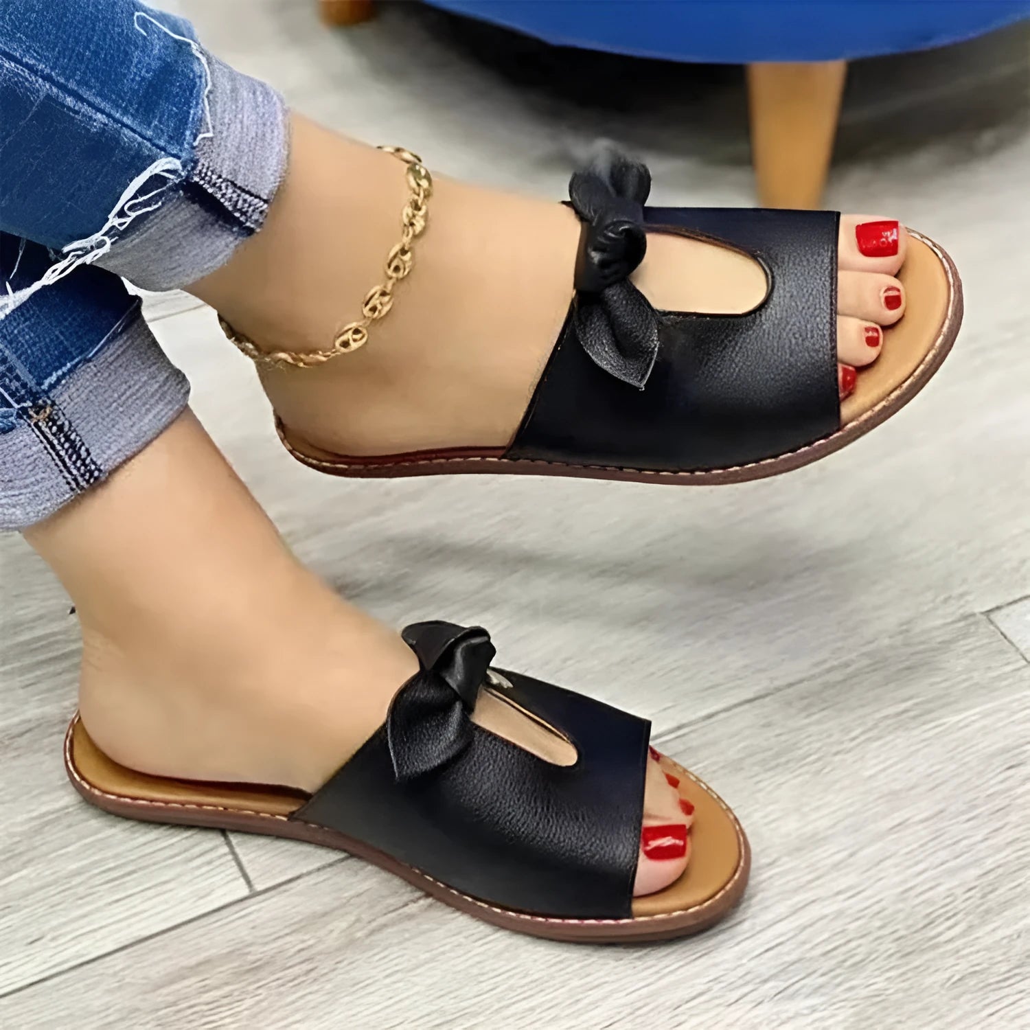 Ladies casual sandals with fish mouth front and decorative bow in black, pink, and gold colours.
