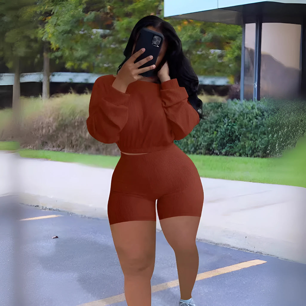 Sunken stripe solid colour off-the-shoulder long sleeve top and shorts two-piece set on a hanger.