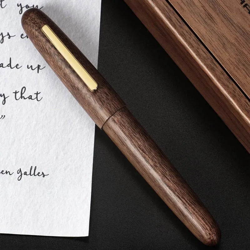 Wooden fountain pen with rotating cap showing choice of ebony, rosewood and tiger ebony finishes