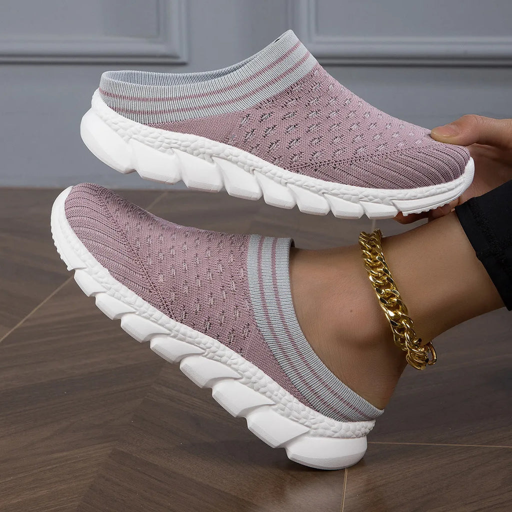 Women's black Flyknit casual shoes with striped pattern, hollowed-out design, and sewing lines on a lightweight sole.