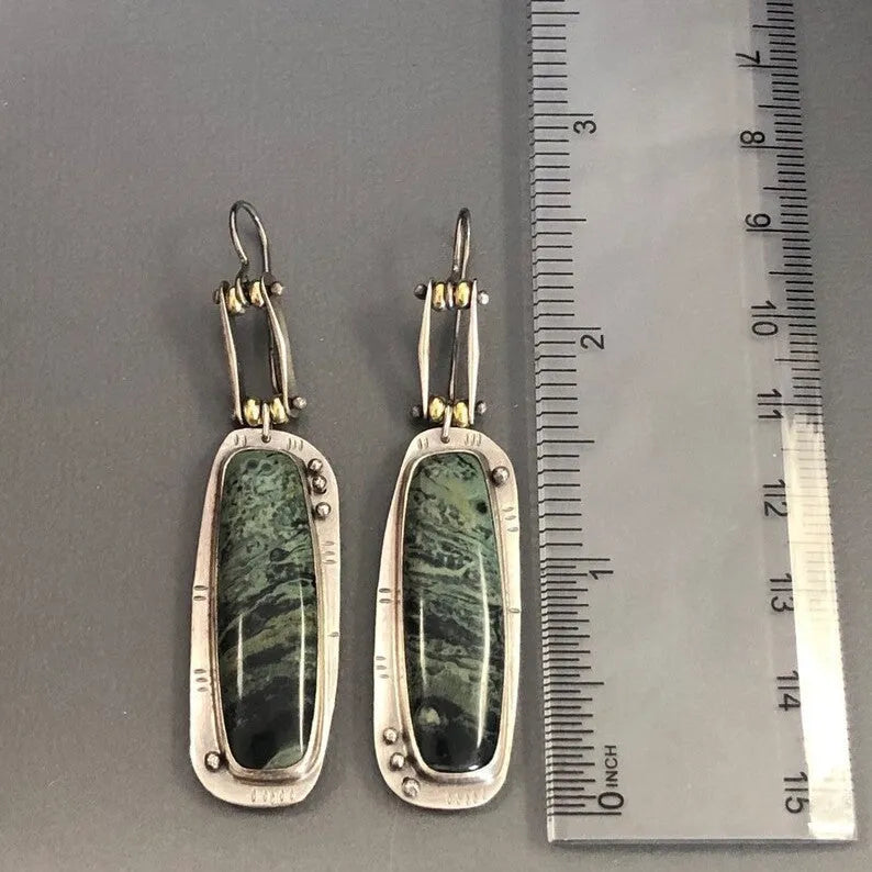 Geometric circular alloy earrings with grey and white marble pattern measuring 20mm diameter