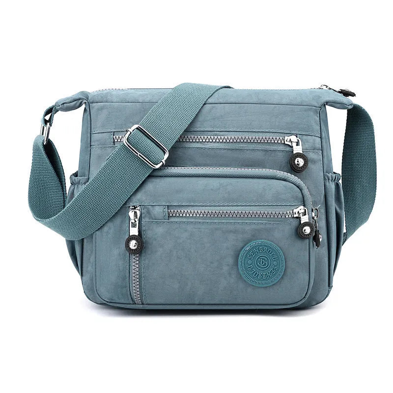 Nylon messenger shoulder bag in square vertical design with single strap and lining