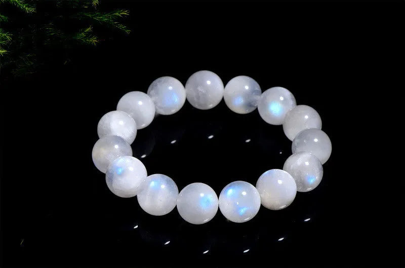 Natural blue moonstone bracelet with polished round beads showing sizing from 5mm to 12mm diameter