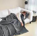 Soft Wind bubble velvet faux rabbit fur blanket in a solid colour, showing its double-sided texture.