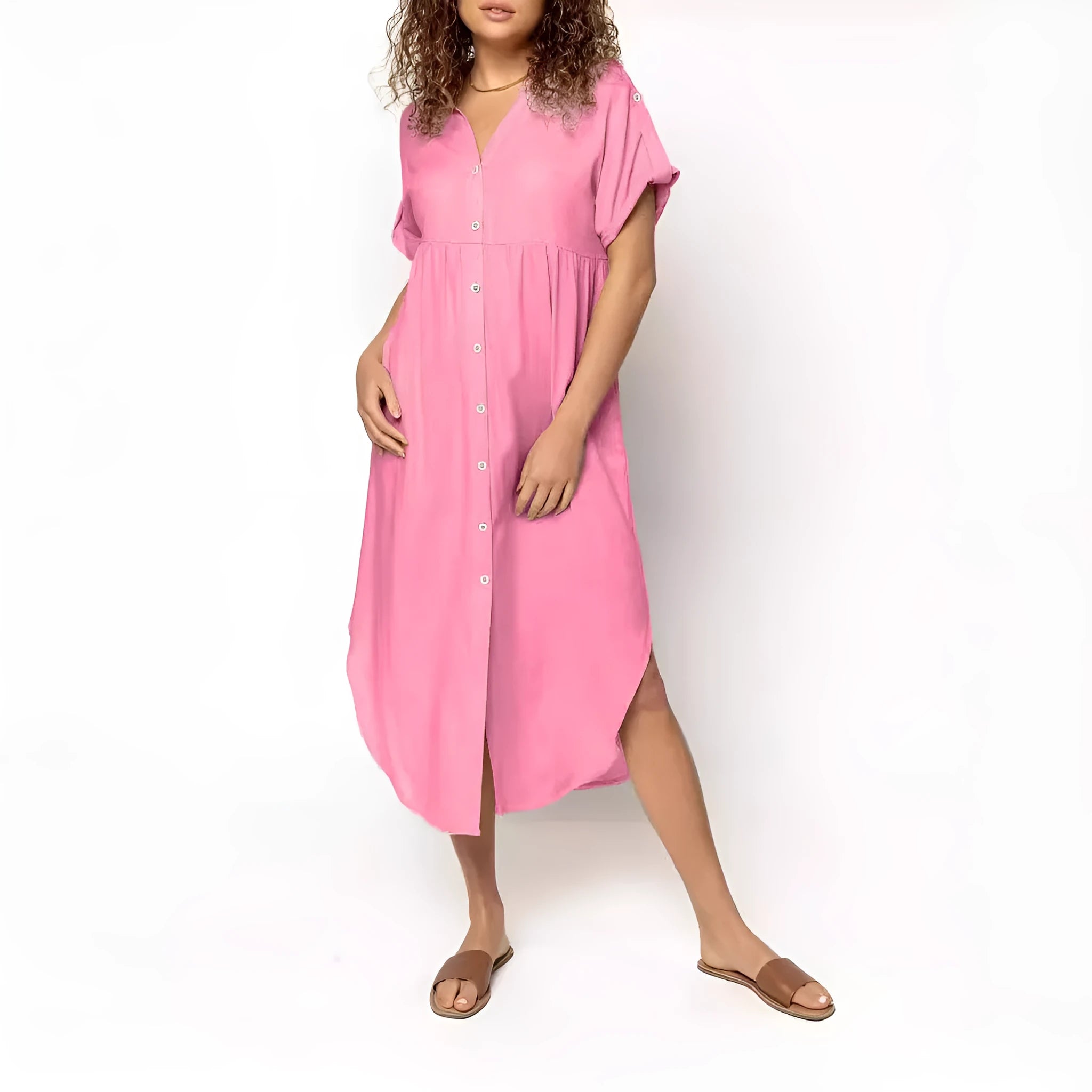 A loose-fitting, mid-length casual dress with button detail on the front, shown in a solid colour.