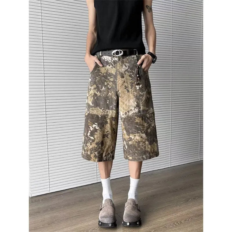 Yellow snake pattern camouflage cropped jeans on a neutral background