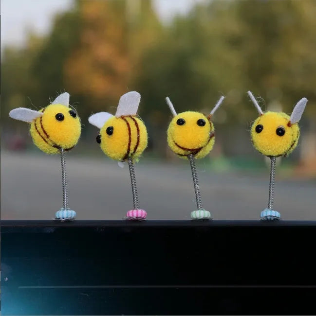Soft fur ball bee car decoration measuring 3x3 centimetres with cartoon design