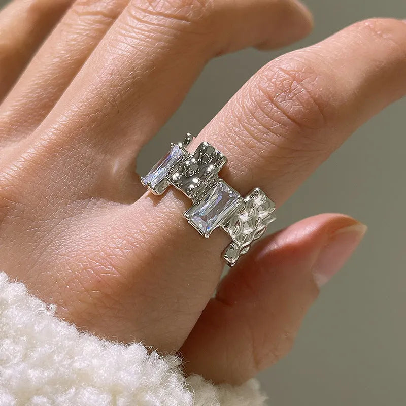 Geometric cross zircon ring in silver-plated metal with open design and three-dimensional decoration