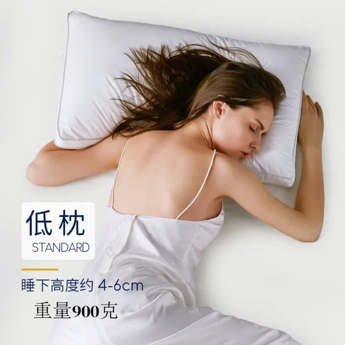 White cotton feather pillow with satin stripe detail, shown in low, medium, and high loft options.