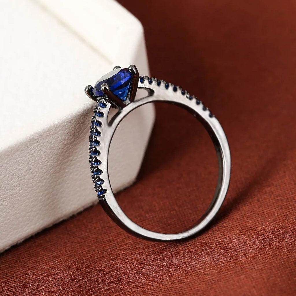 Geometric hexagon copper ring with colourful zircon stones in gold or gun black electroplated finish.