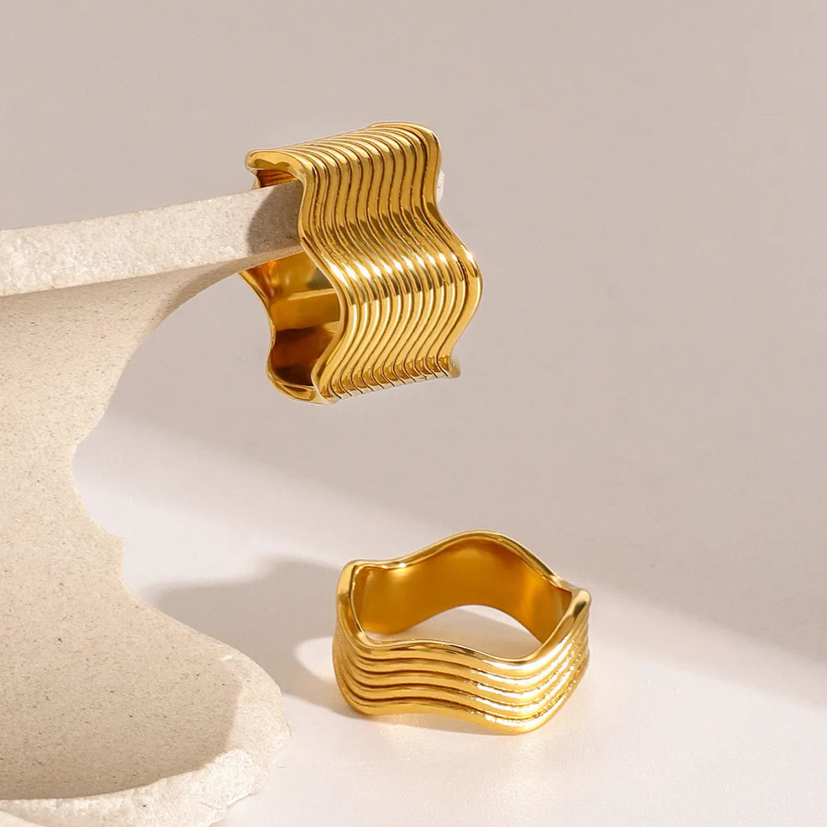Stainless steel geometric wave ring with electroplated finish in gold or silver tone