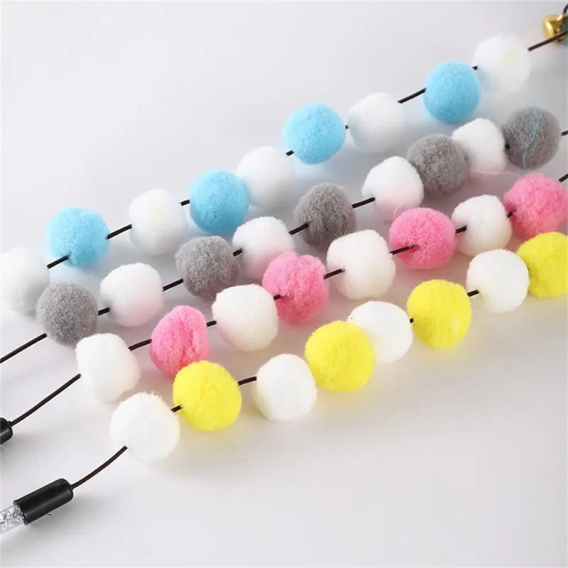 Grey, yellow and blue cat teaser rod with bell and feather attachment, 31cm long