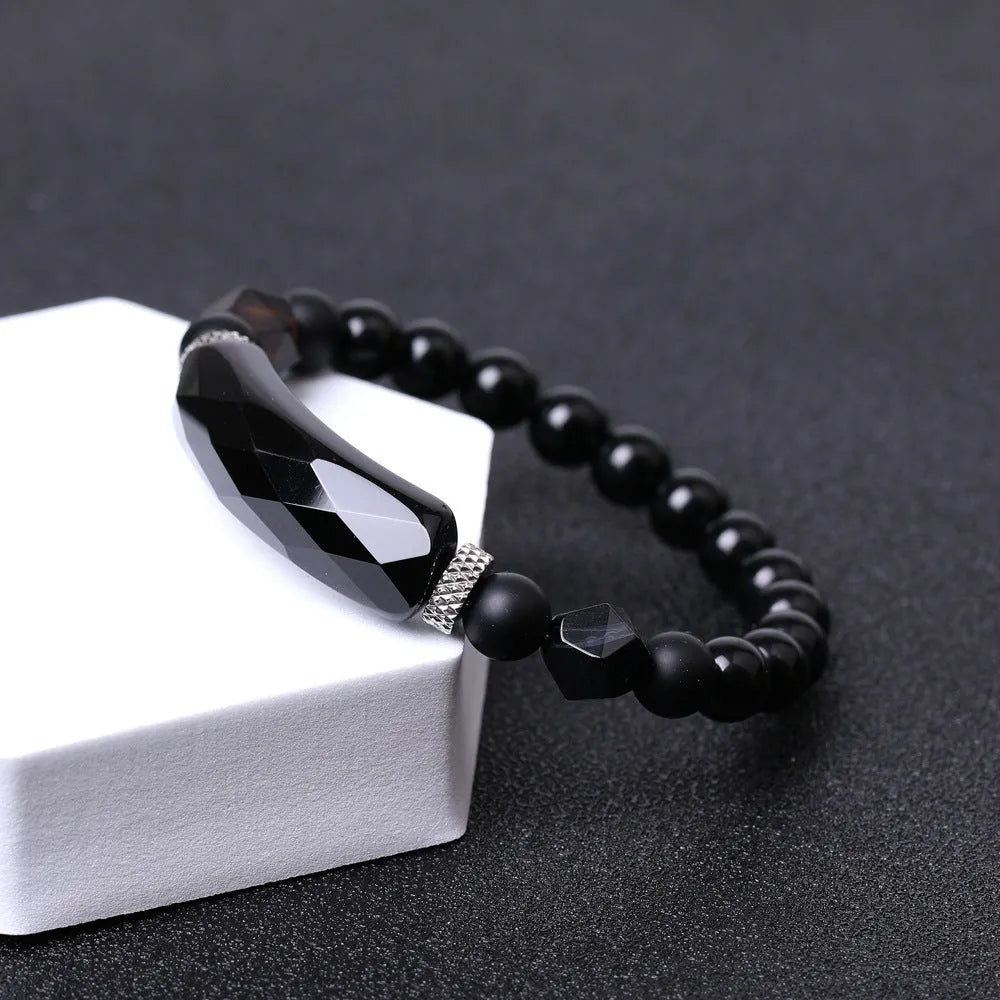 Handmade geometric bracelet with diamond-cut black agate beads and fan-shaped design elements.