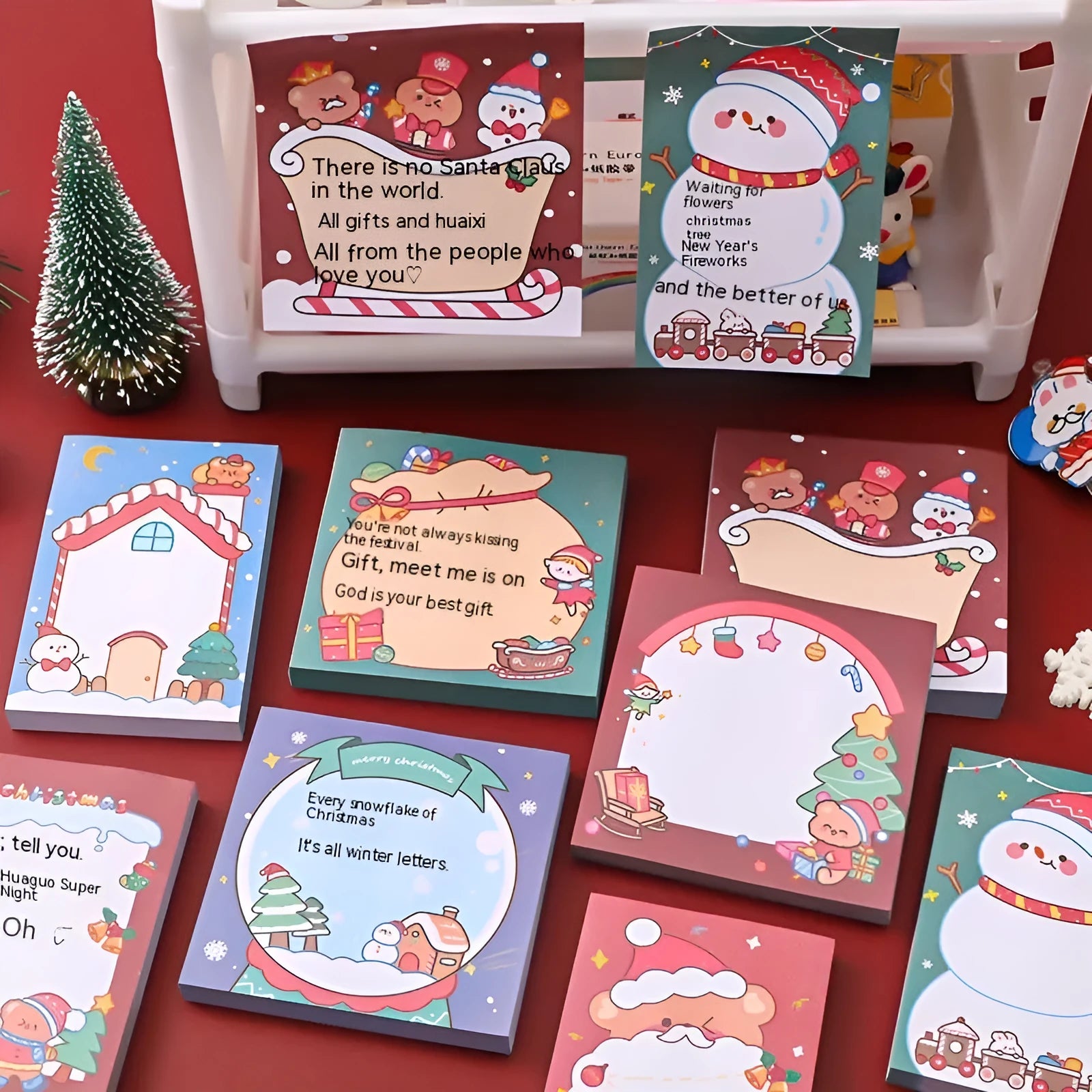 Christmas sticky notes book showing eight cartoon designs including Santa Claus, Christmas Elf, and Snowman