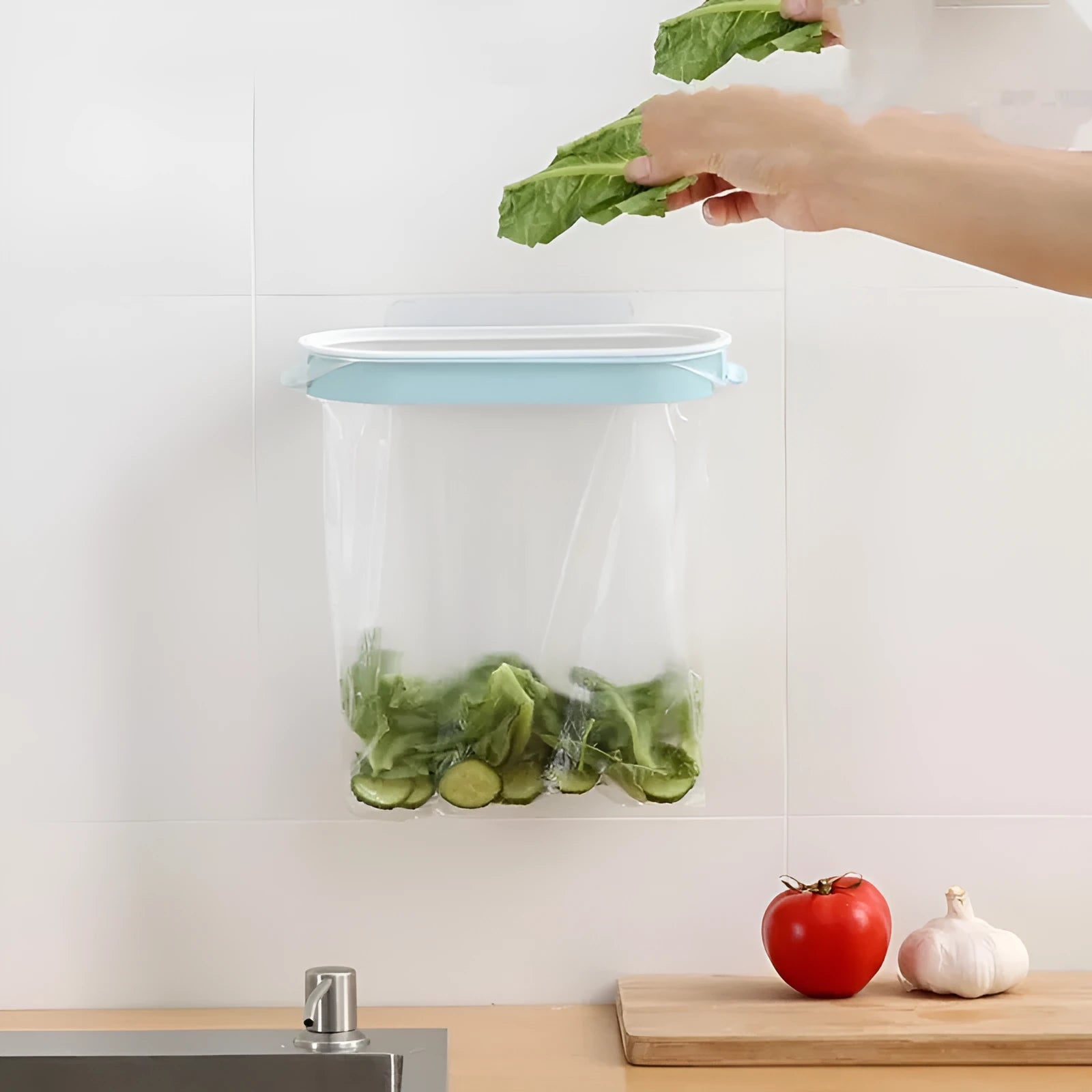 Blue plastic kitchen garbage bag storage rack mounted inside a cabinet.